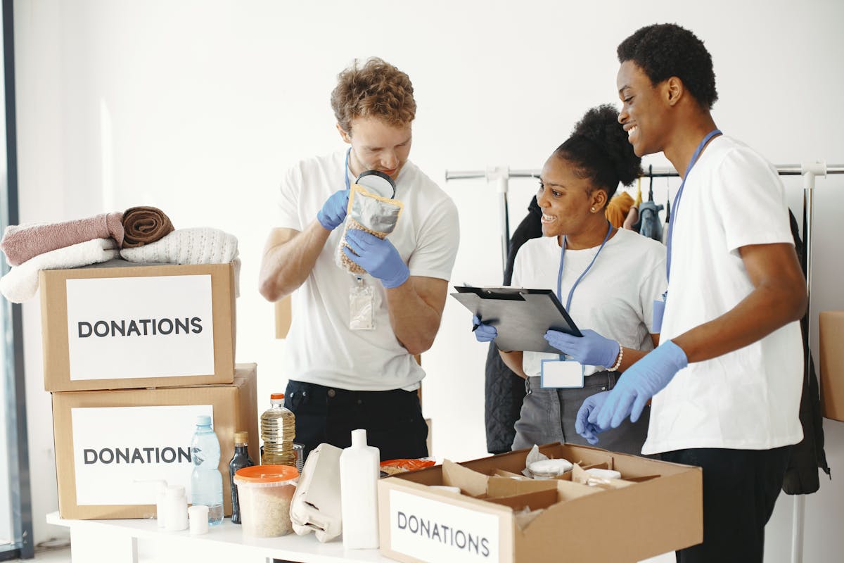 Volunteers sorting donations and supplies indoors